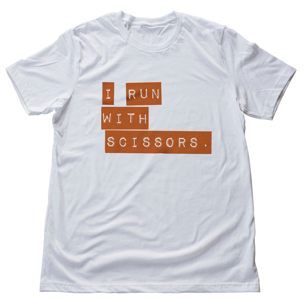 Humorous, sarcastic graphic t-shirt featuring the old joke "I run with scissors." 